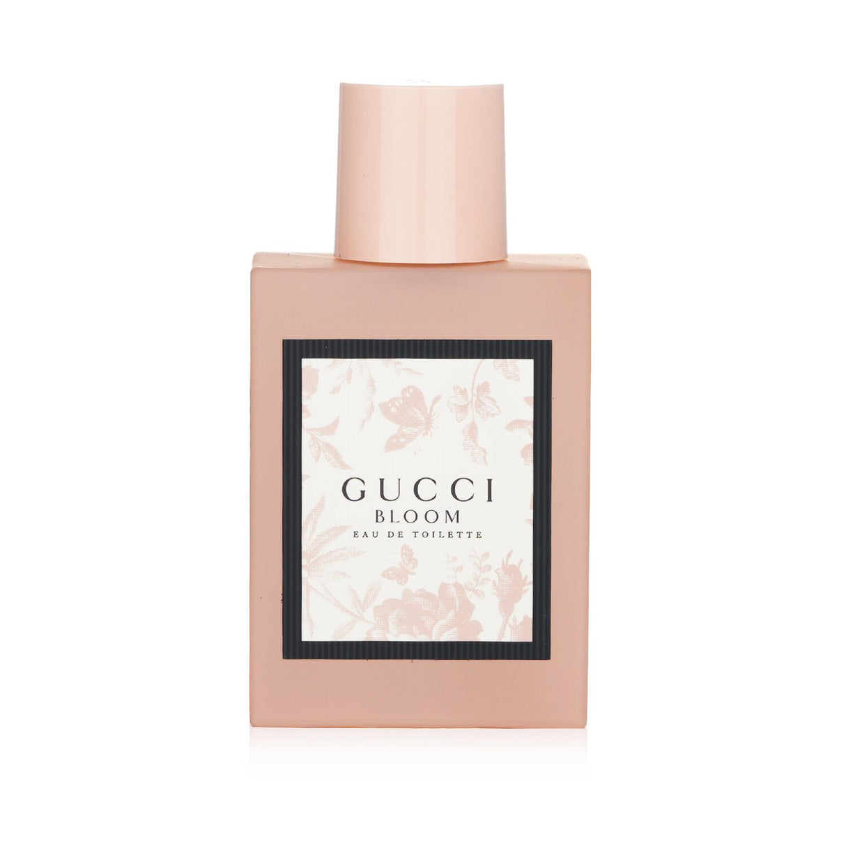 Gucci Bloom Eau De Toilette Spray in a frosted pink bottle, featuring floral notes for a fresh and radiant feminine scent.