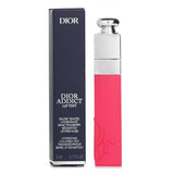 Dior Addict Lip Tint in Natural Coral, 5ml, offers vibrant color, hydration, and a semi-matte finish with natural ingredients.