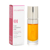 Clarins Lip Comfort Oil #01 Honey in a 7ml bottle, offering nourishing hydration and a radiant, dewy finish for lips.