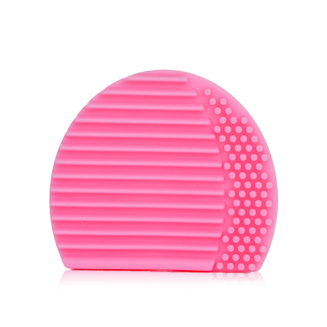 Elegant pink silicone makeup brush cleaner with dual textures for thorough cleaning of face and eye brushes.
