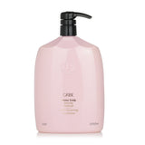 Luxurious 1000ml Oribe conditioner that soothes the scalp, hydrates hair, and removes dandruff for silky, bouncy locks.