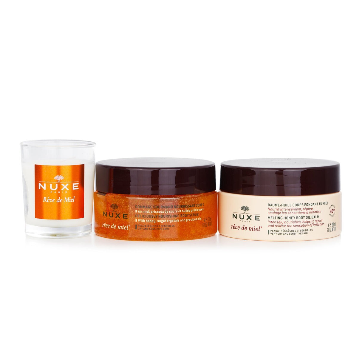 Nuxe Honey Lover Set: 3-piece skincare collection with body scrub, oil balm, and soothing candle for silky, nourished skin.