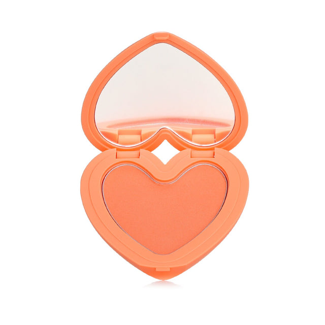 Lilybyred Luv Beam Cheek #03 in a heart-shaped case, offering smooth, radiant coral-orange blush infused with rose oil.