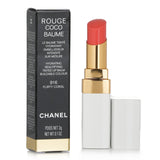 Chanel Rouge Coco Baume in #916 Flirty Coral, a hydrating tinted lip balm offering buildable color and 12-hour comfort.