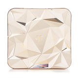 Cle De Peau Luminizing Face Enhancer #201 Twilight's Glow in an elegant case, featuring a seashell-inspired design for radiant skin.