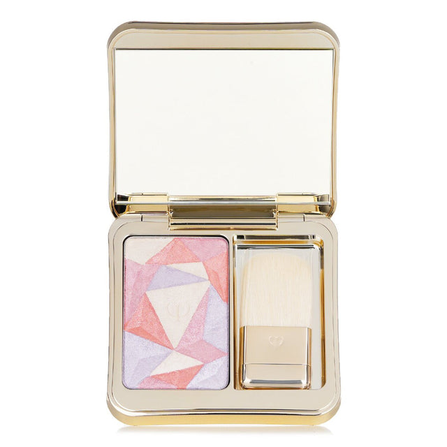 Cle De Peau Luminizing Face Enhancer in #201 Twilight's Glow with luxurious, brightening powder in a jeweled case.