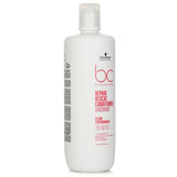 Creamy vegan conditioner for damaged hair, revitalizing with arginine and keratin, improves breakage, and enhances shine.