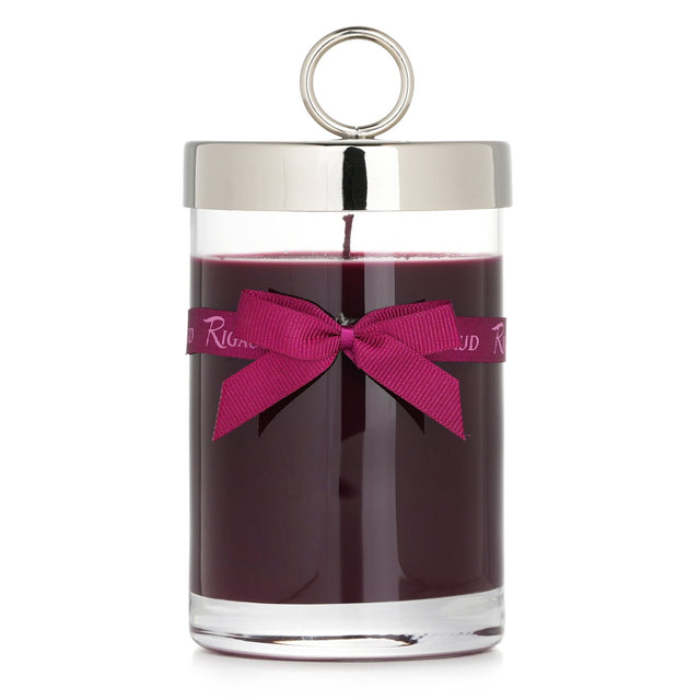Rigaud Scented Candle in elegant glass, blends patchouli and teak for a luxurious woody aroma; burns for 90 hours.