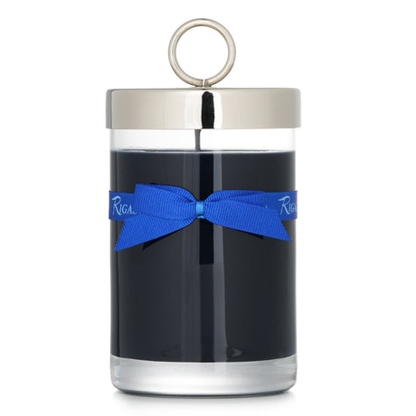 Luxurious Rigaud scented candle in transparent glass, emits a sensual, warm aroma inspired by the night sky, 90-hour burn time.