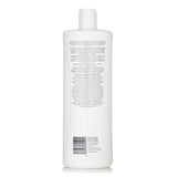 Nioxin Density System 4 Conditioner for colored hair strengthens and hydrates, enhancing color protection and fullness.