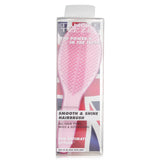 Tangle Teezer Ultimate Styler brush in Sweet Pink, designed for smooth, shiny hair and ideal for detangling and styling.