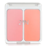 Blush duo featuring #4 Hot Living Coral with a creamy finish, perfect for a radiant, versatile complexion.