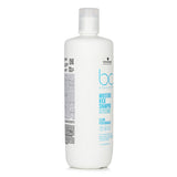 Hydrating Schwarzkopf BC Moisture Kick Shampoo, 1000ml, enriches normal to dry hair with moisture and enhances softness and shine.