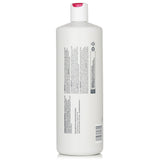 Sebastian Penetraitt Conditioner 1000ml: A repairing formula for all hair types, enhances moisture, strength, and elasticity.