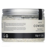 Cowshed Revive Foot Scrub in a 150g jar: a revitalizing blend of avocado oil, volcanic sand, and essential oils for smooth feet.
