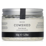 Cowshed Revive Foot Scrub 150g: A revitalizing foot scrub with avocado oil and volcanic sand for smooth, refreshed feet.