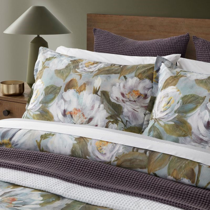 Watercoloured floral duvet cover set with matching blue sheets, made of 100% certified cotton, ethical Turkish design.