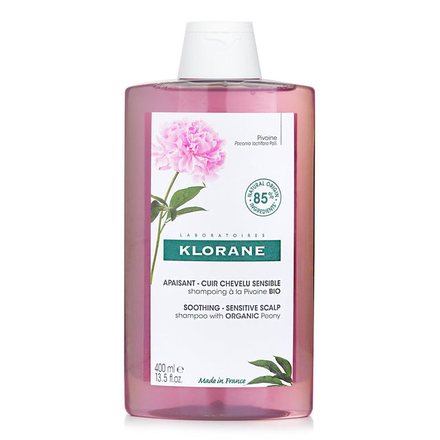 Gentle Klorane Shampoo with peony extract for irritated scalps, 400ml, 85% natural ingredients, eco-friendly packaging.