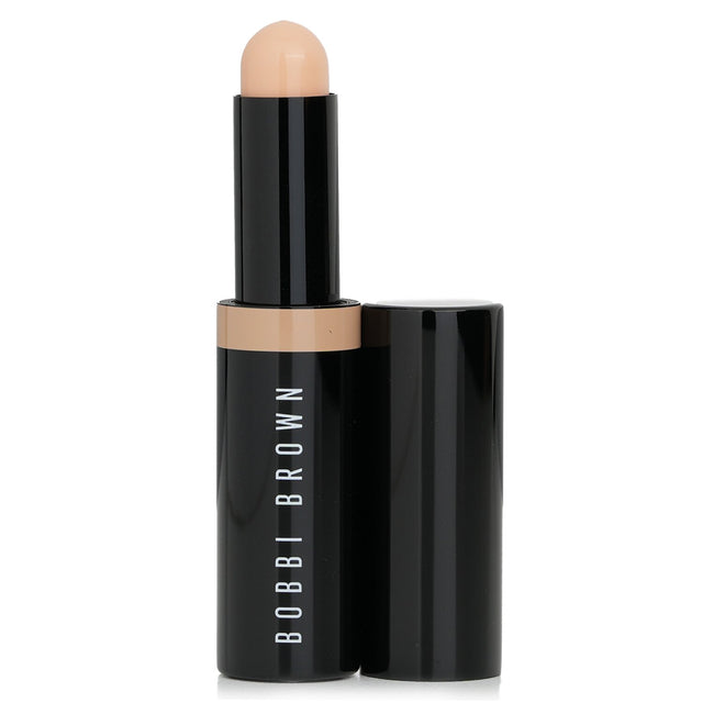 Bobbi Brown Skin Concealer Stick in Warm Ivory, 3g; smooth, creamy formula for brightening, covering blemishes, and lasting wear.