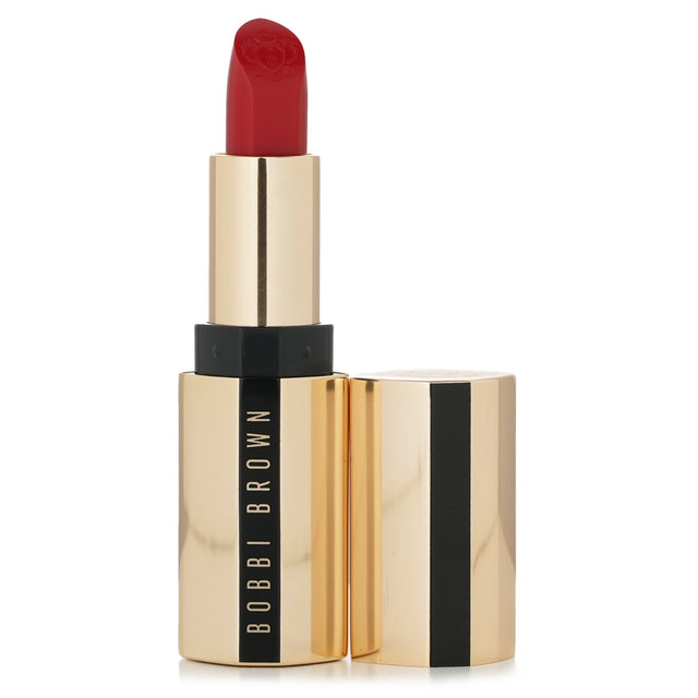 Luxurious Bobbi Brown Luxe Lipstick in #Parisian Red with satin finish, combining vibrant color and skincare benefits for smooth lips.