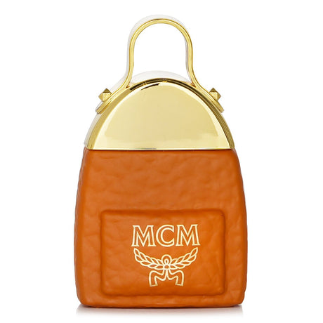 MCM Eau De Parfum Spray miniature in a backpack-shaped bottle featuring floral woody notes, perfect for on-the-go elegance.