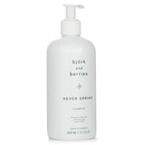 Eco-luxury shampoo with organic extracts, enriched for shiny, healthy hair; vegan, sulphate-free, in a recycled bottle.