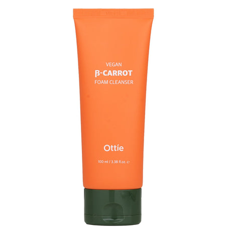 Ottie Vegan Beta-Carrot Foam Cleanser in a 100ml bottle, featuring AHA, BHA, and PHA for gentle exfoliation and hydration.