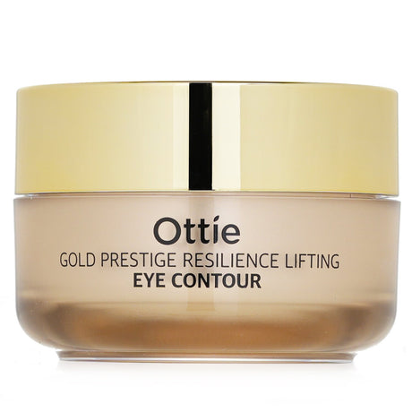 Ottie Gold Prestige Resilience Eye Contour cream in a 30ml bottle, targeting fine lines with hydrators and antioxidants for youthful skin.