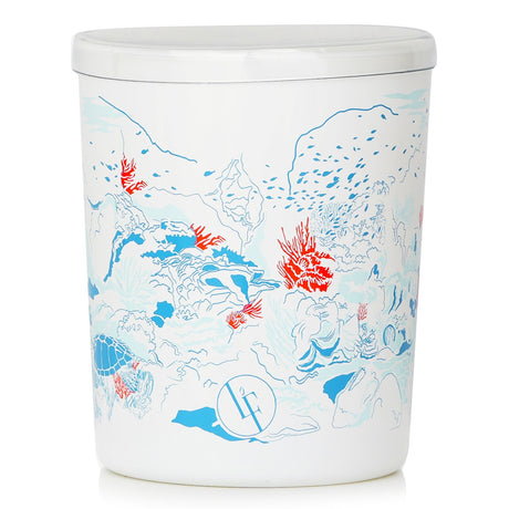 Ocean-inspired Coral Garden scented candle in a white glass holder, featuring fresh marine notes and a 40-hour burn time.