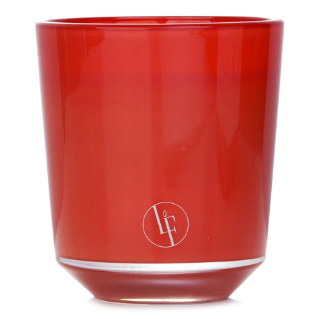 Luxurious Ambre Tan scented candle in coppery brown, featuring heliotrope, amber, and benzoin notes, burns for 40 hours.
