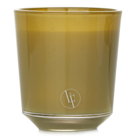 Elegant Bronze Santal scented candle in a colored glass container, offering a soothing woody fragrance for relaxation.