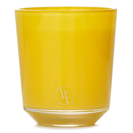 Lemon Fizz Candle in vibrant yellow glass, infusing rooms with zesty lemon, mint, and tea aromas for 40 hours of cheer.