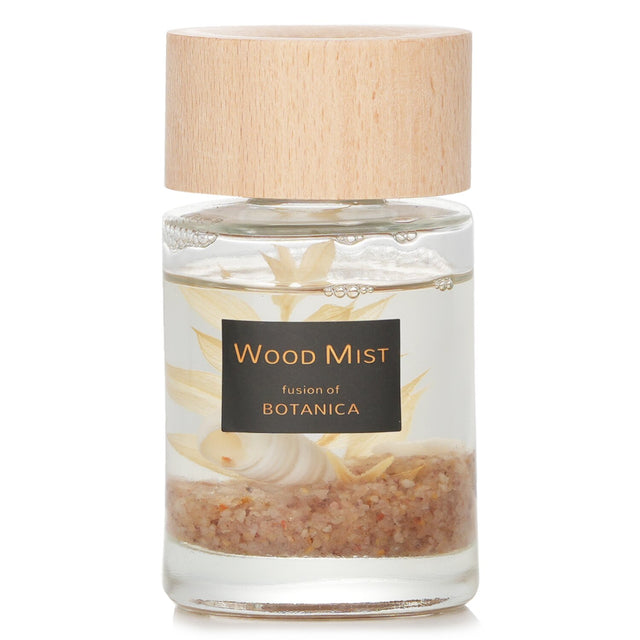 Reed diffuser in a clear bottle with wooden lid, releasing soothing Sleep Ocean fragrance for relaxation.