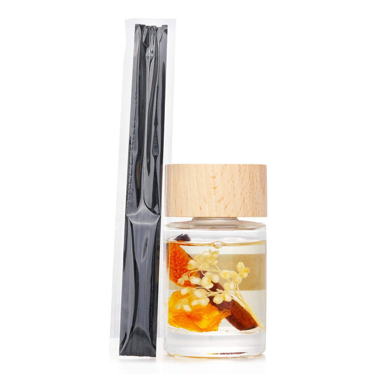 A stylish reed diffuser in a transparent bottle, infused with Orange Cinnamon scent and topped with a wooden lid.