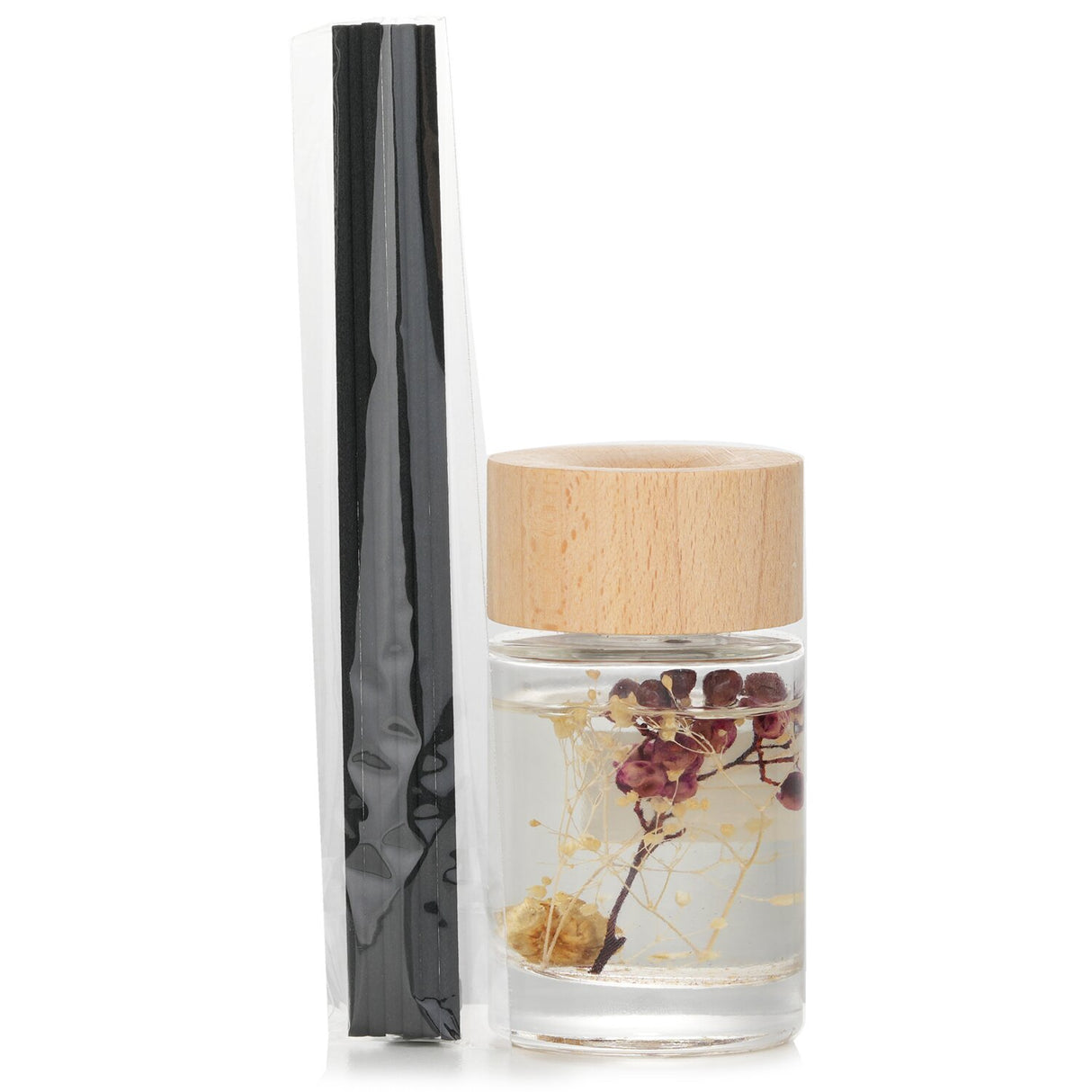 Botanica Wood Mist Reed Diffuser in Red Berry, eco-friendly with floral and woody notes in a stylish transparent bottle.