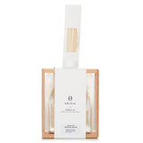 A sleek reed diffuser set with 270ml fragrance oil, wooden stand, and 6 reed sticks for a serene home ambiance.