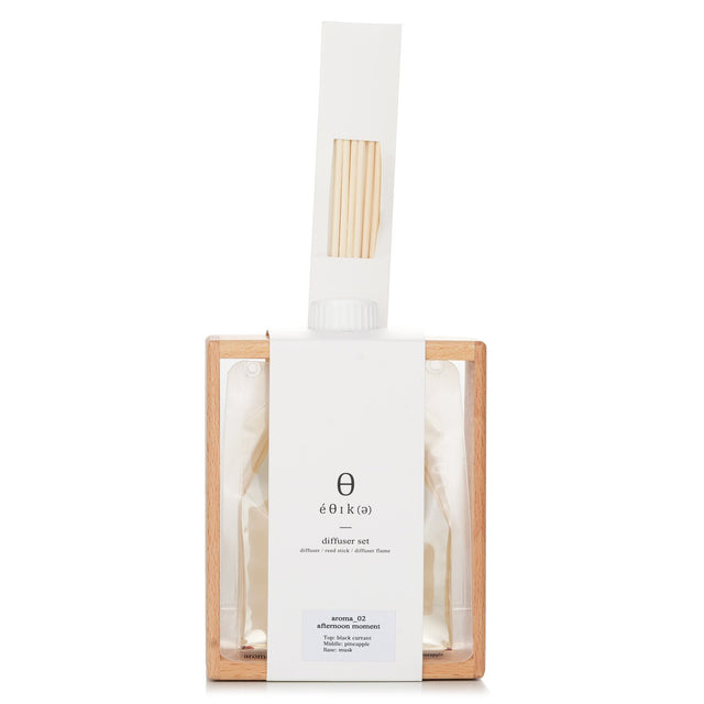 A sleek reed diffuser set with 270ml fragrance oil, wooden stand, and 6 reed sticks for a serene home ambiance.