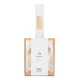 Elegant reed diffuser set with soothing aromas, wooden stand, and stylish design for home relaxation and decor.