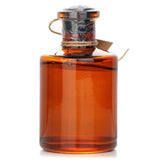 Elegant white musk diffuser in a stylish design, delivering enchanting floral aromas for a serene home atmosphere.