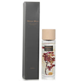 Elegant Botanica Reed Diffuser in Red Berry, featuring vibrant scents and a stylish wooden lid for a cozy atmosphere.