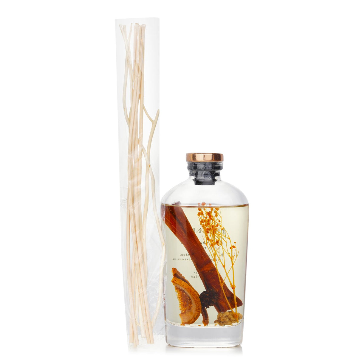 Citrus reed diffuser in a transparent bottle, featuring vibrant aromas and elegant botanical design, perfect for home decor.