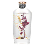 Botanica home fragrance reed diffuser in berry, featuring a transparent bottle and vibrant botanicals for a soothing aroma.