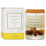 Elegant orange-scented candle in glass jar with wooden lid, promoting relaxation and enhancing home ambiance.