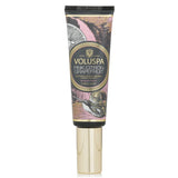 Voluspa Pink Citron Grapefruit Hand Cream, 50ml, enriched with avocado oil and shea butter, offers luxurious hydration and a fruity scent.