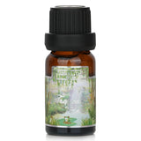 10ml bottle of Carroll & Chan's Tropical Forest fragrance oil, evoking lush scents of sea moss, redwoods, and vetiver.