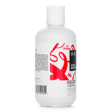 A bottle of IGK Good Behavior Ultra Smooth Conditioner, 236ml, designed for frizz-free, shiny, and manageable hair.