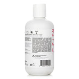 Bottle of IGK Good Behavior Ultra Smooth Shampoo, featuring 7 smoothing oils for frizz control and healthy, shiny hair.