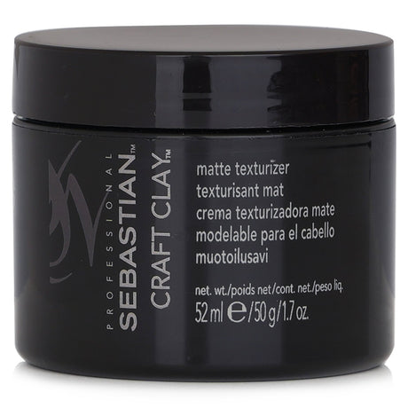 Matte texturizing clay for flexible hold, ideal for short to medium hair, creates natural texture and separation.