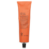 Nourishing Oway After Sun Hair Mask revitalizes sun-damaged hair with a citrus-woodsy scent for sleek, healthy locks.