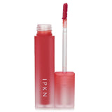 Sheer tint in #01 Chiffon Apricot, providing a radiant, glassy glow with a smooth, plumping finish for vibrant lips.